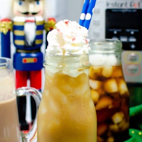 peppermint mocha iced coffee drink with whipped cream and straws in it