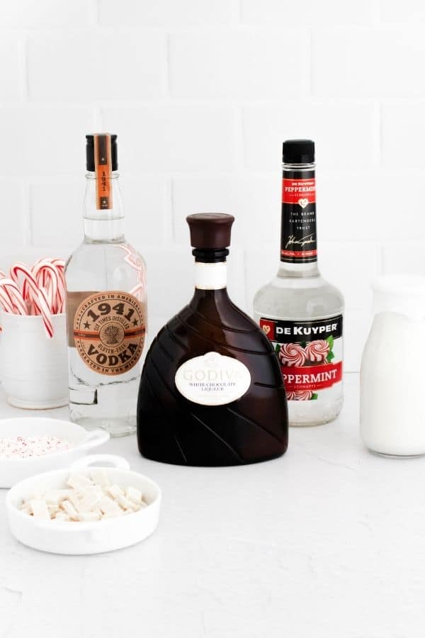 Christmas cocktail ingredients on the counter 