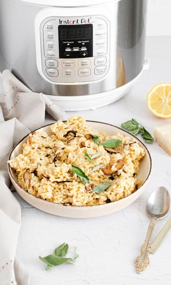 easy mushroom risotto on bowl with instant pot behind it 