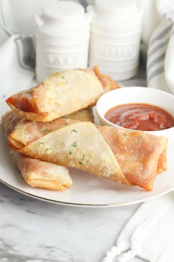 egg rolls with sauce on counter