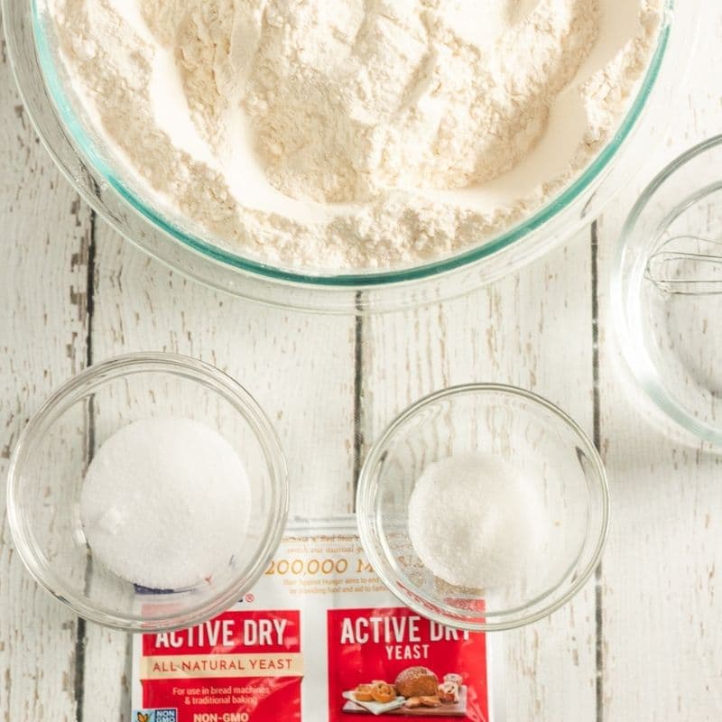 ingredients for making bread on white wood  table