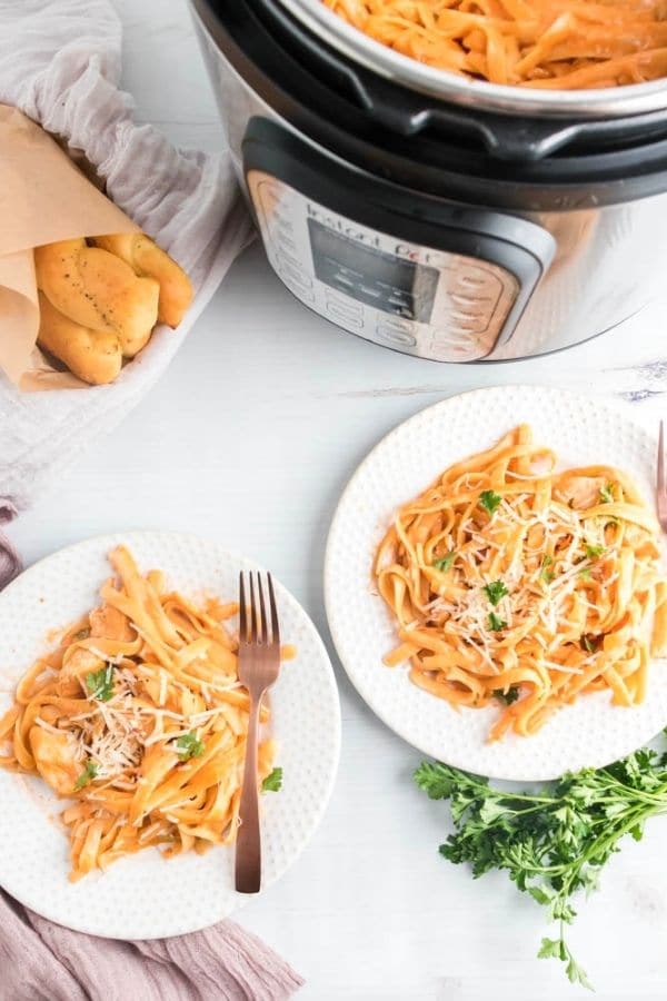 plates of pasta sacue with instant pot by it 