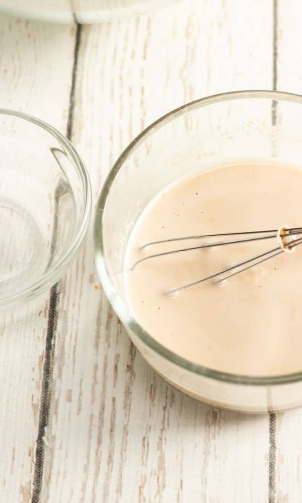 yeast in a bowl with whisk 