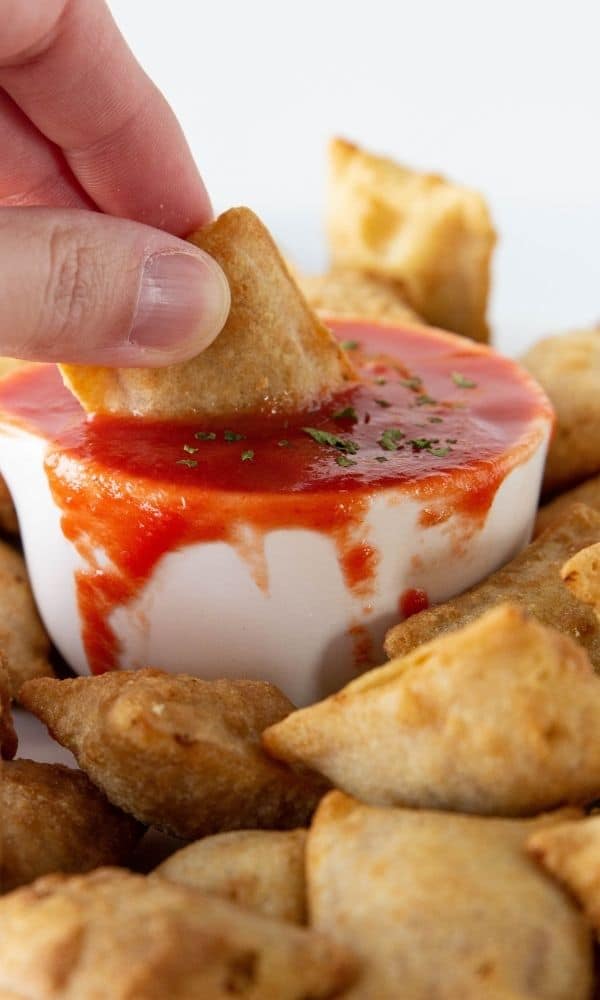 pizza roll dipped in sauce 