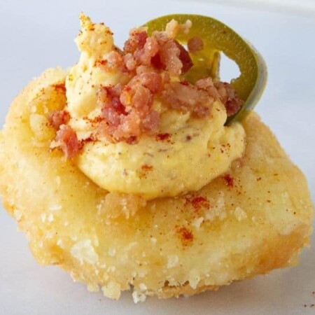 fried deviled eggs with bacon and jalapeno on counter