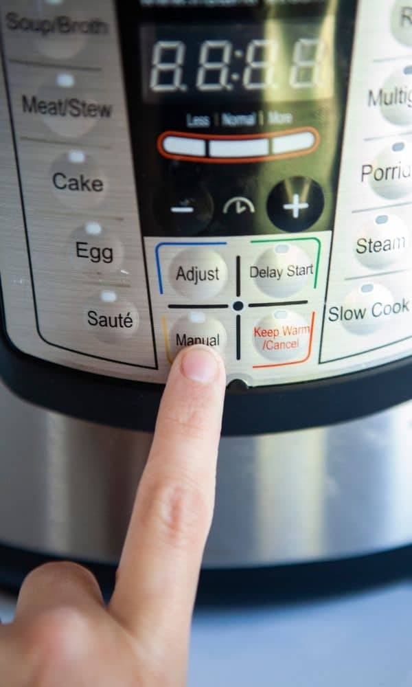 pushing manual button on instant pot 