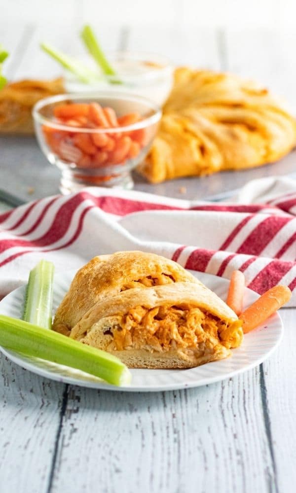 crescent roll ring sliced and on plate with celery sticks