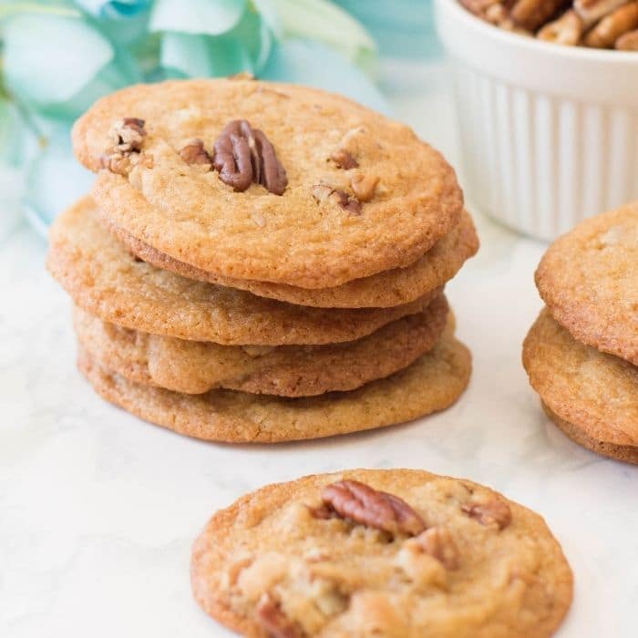 stacked cookies with flowers behind them on counter 