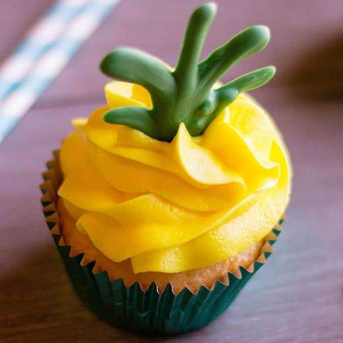 cupcake on counter with yellow frosting 