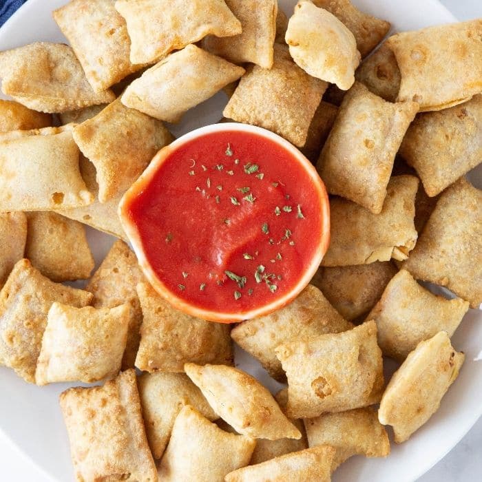 pizza rolls on plate with sauce for dipping