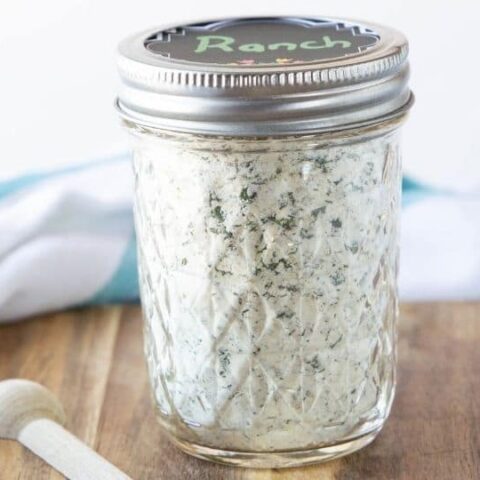 ranch in a container with spoon by it