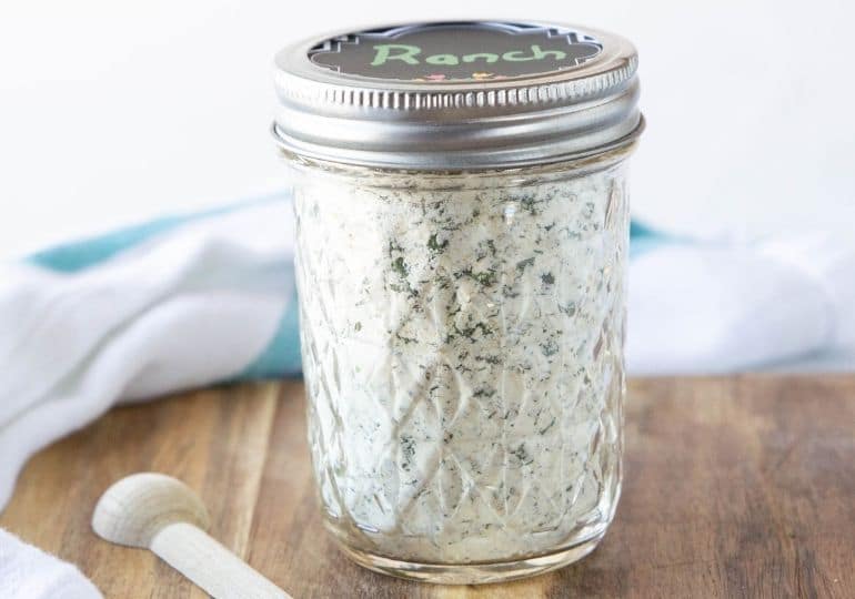 ranch in a container with spoon by it