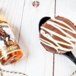 boozy cocoa ball on a spoon with rum by it