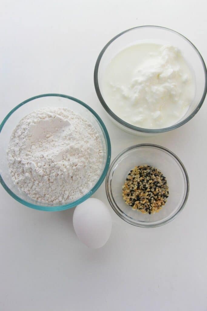 greek yogurt bagel ingredients on white table 