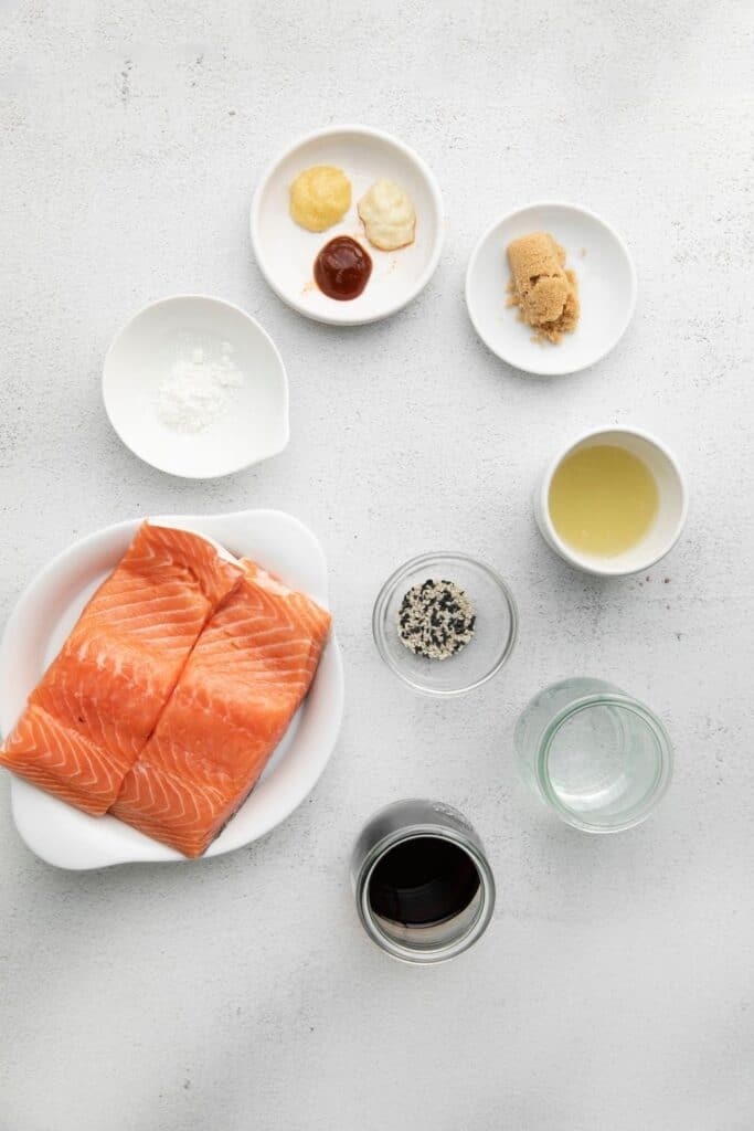 honey glazed salmon ingredients on table in bowls 