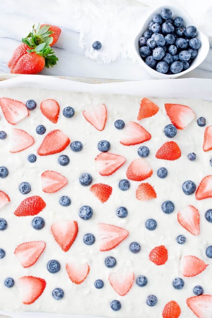 sheet pan pancakes with berries on top 