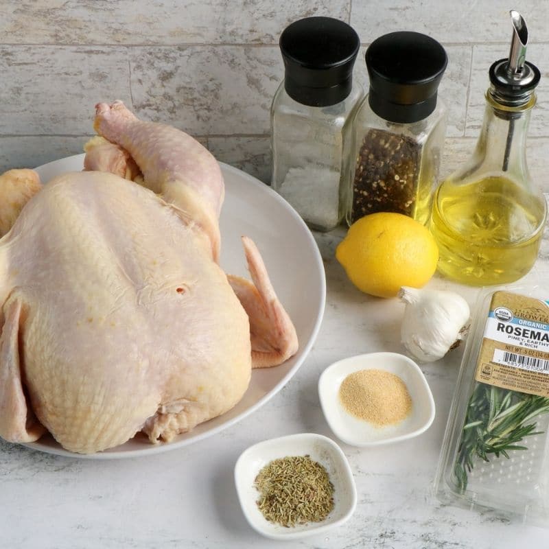 chicken and spices and ingredients on counter