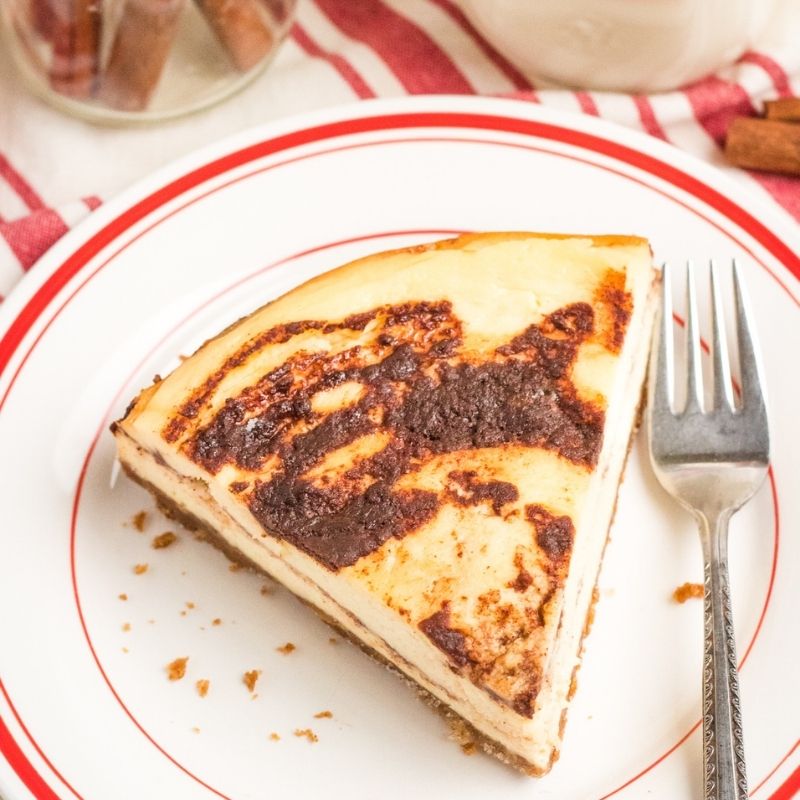 cinnamon cheesecake on a plate with fork by it 