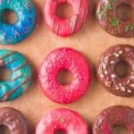 wooden plate with donuts on it