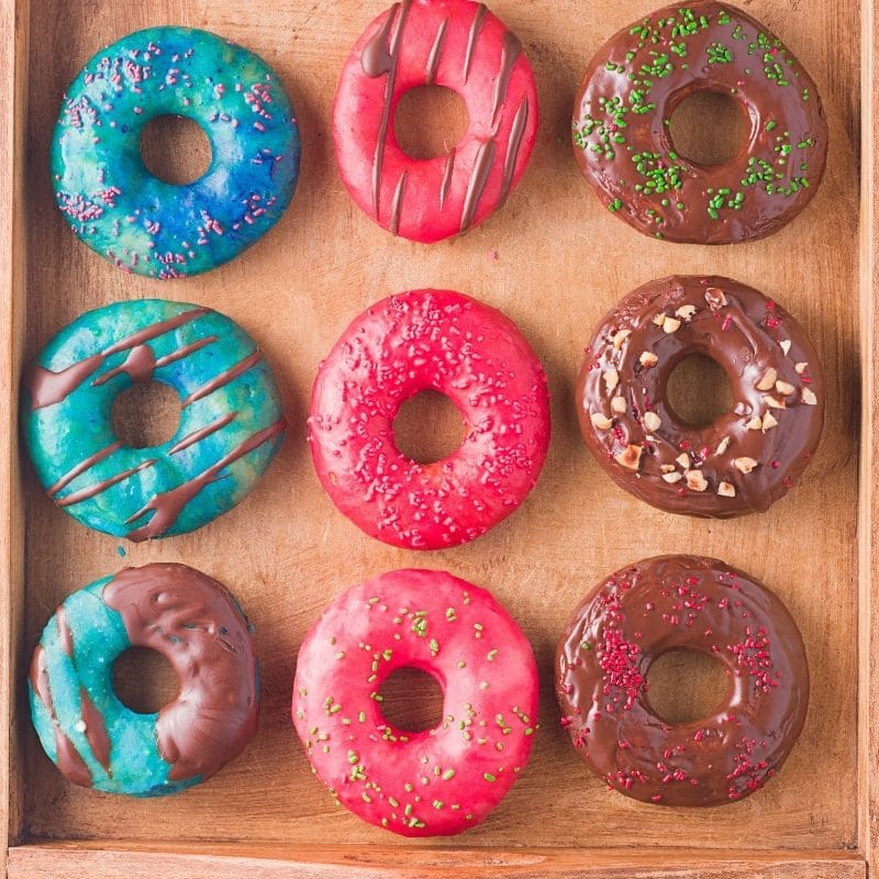 glazed donuts on a wooden tray