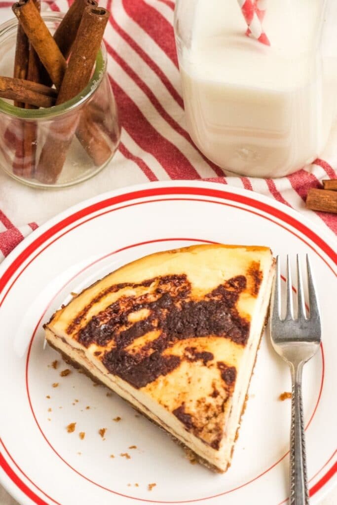 instant pot cinnamon roll cheesecake on plate 