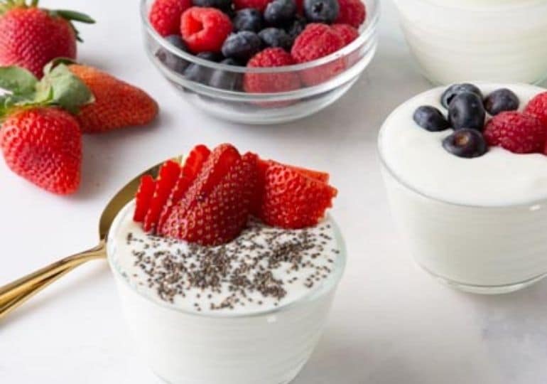 yogurt in cups on table