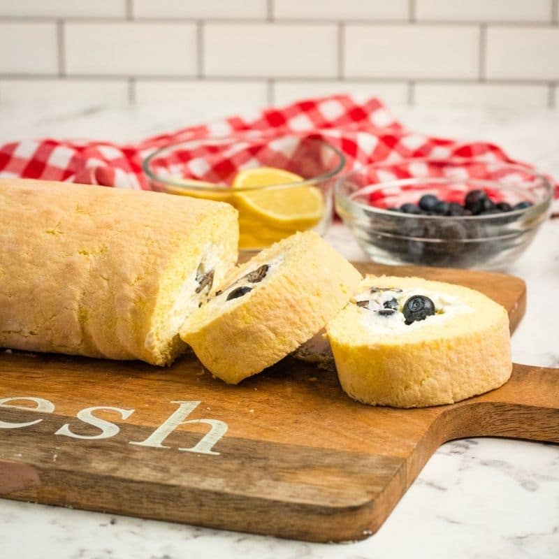 lemon loaf sliced on a cutting board