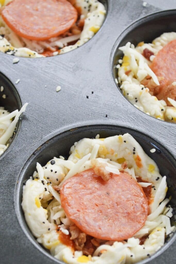 close up of pizza biscuits in muffin in 