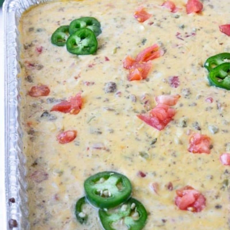 queso dip in a throw away aluminum pan 