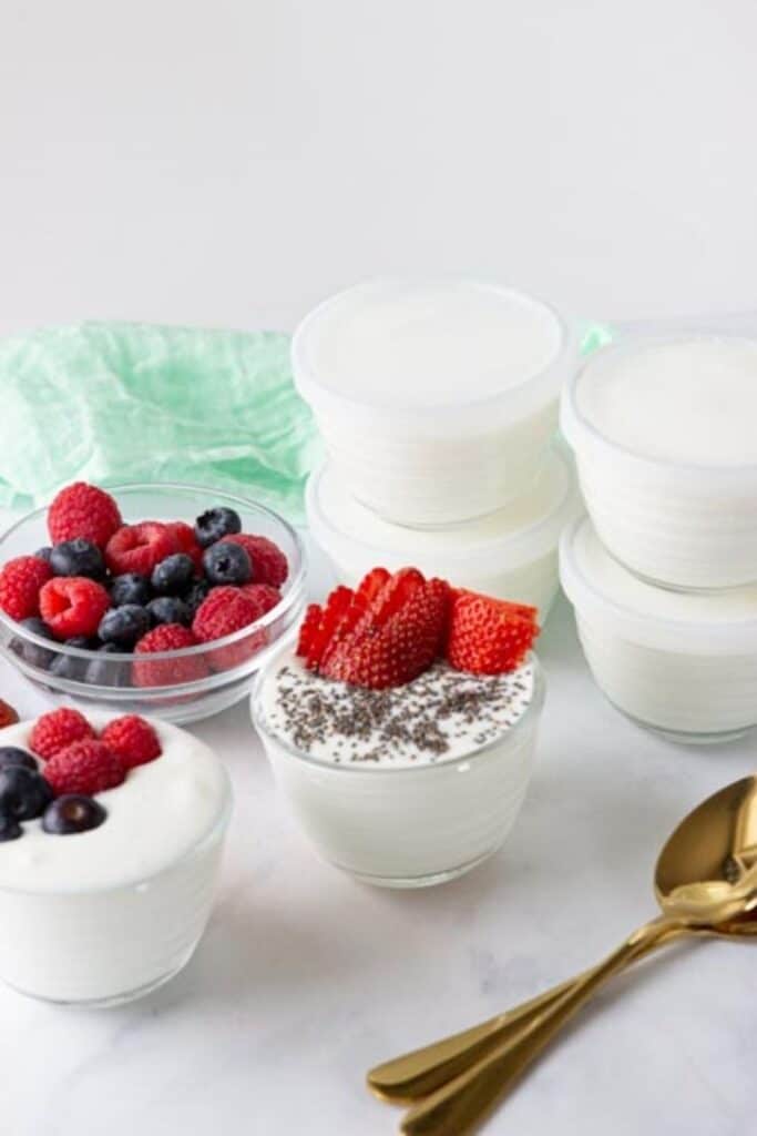 yogurt in bowls with spoon by it 