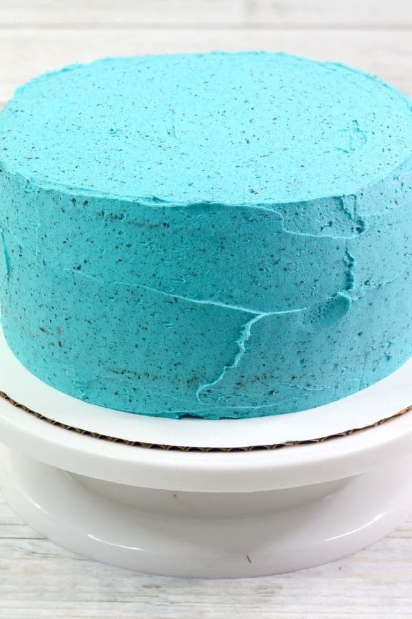 blue cake on a cake stand 