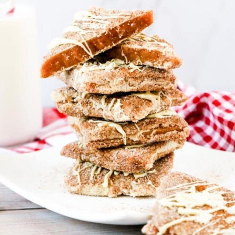 stacked toffee on white plate with napkin behind it