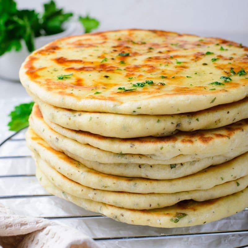 homemade flatbread stacked on top of each other