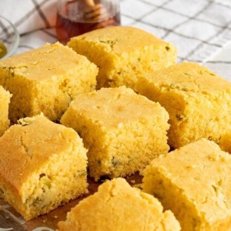 cornbread sliced up and placed on a cooling rack