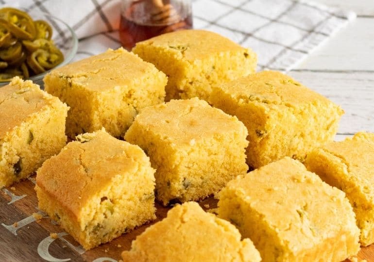 cornbread sliced up and placed on a cooling rack