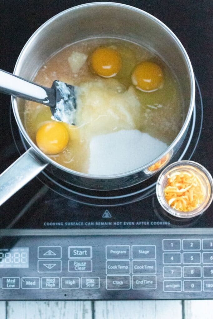 making orange curd in pan 