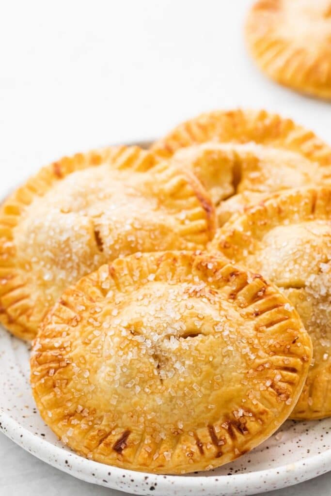 apple hand held pies on a plate