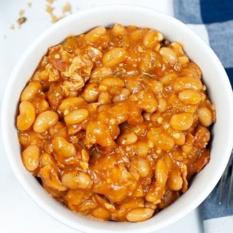 baked beans in a bowl with fork by it