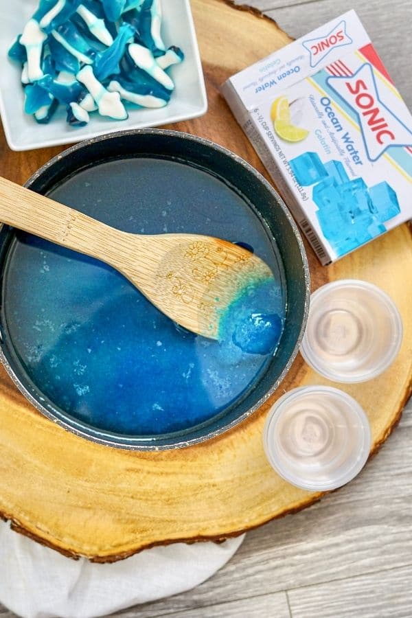 jello in a pan with blue gummies by it