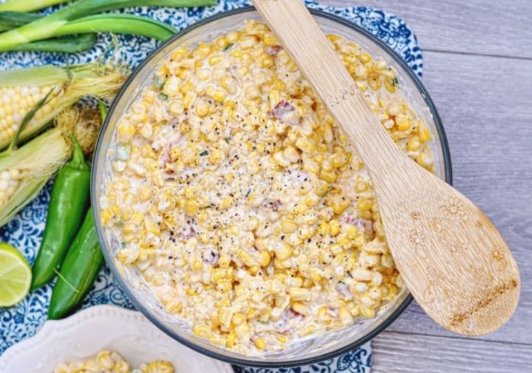 corn salad in a bowl with spoon on top