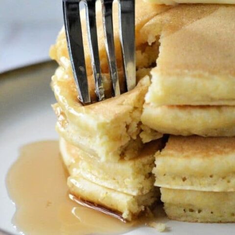 cornmeal pancakes with fork in it