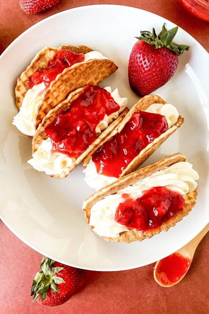 dessert taco  on a plate with berries 