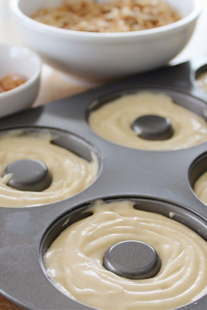 piped donuts in donut pan 