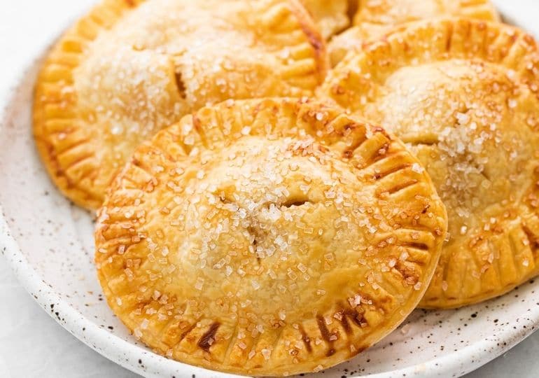 golden hand pies on a plate