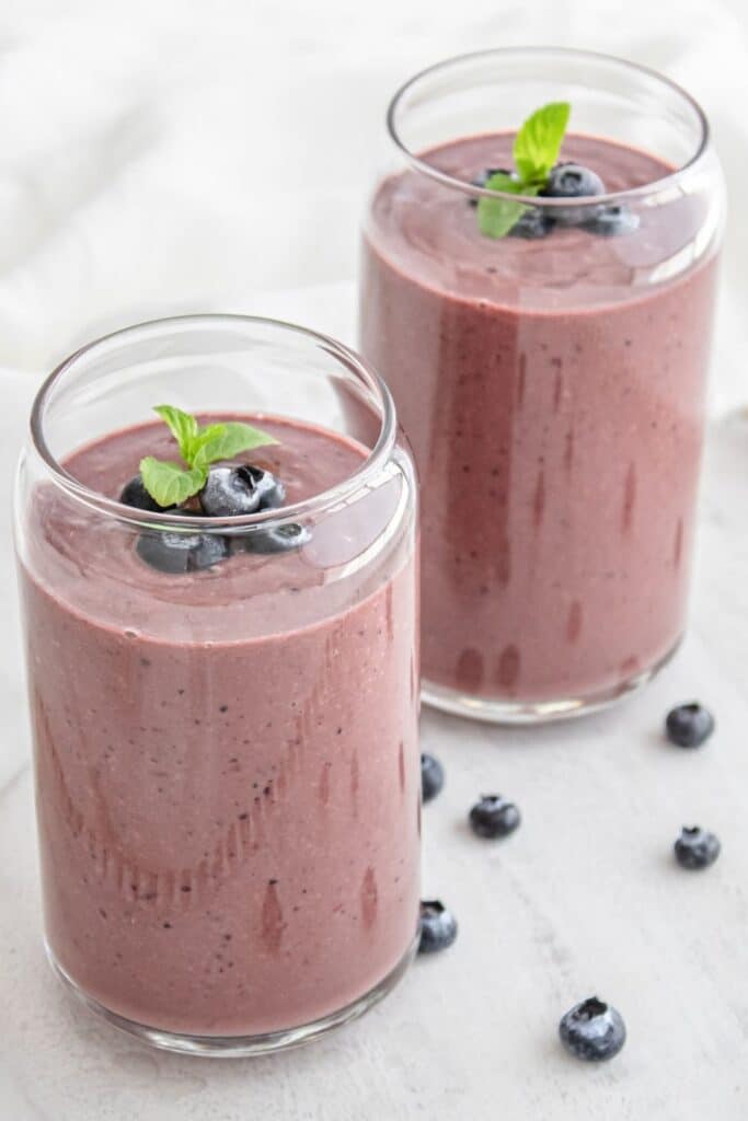 smoothies in two cups on table 