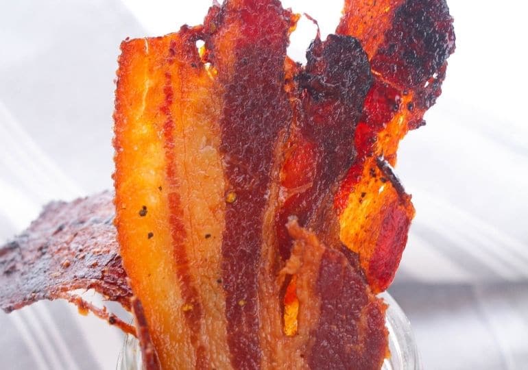 bacon in a glass jar on counter