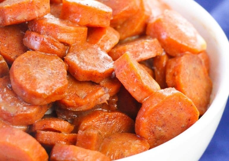 candied carrots in a white bowl