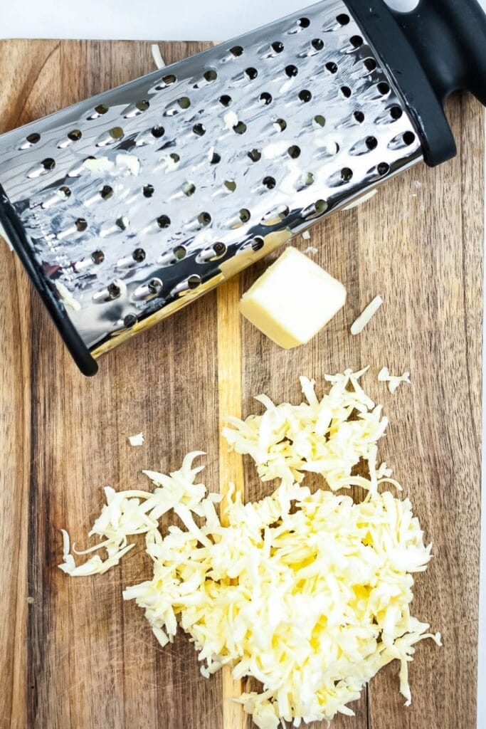 grated butter on a wooden cutting board 