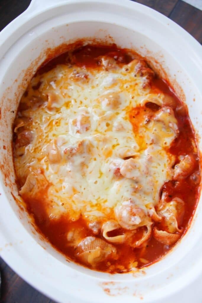 overhead shot of chicken parmesan pasta in crockpot 