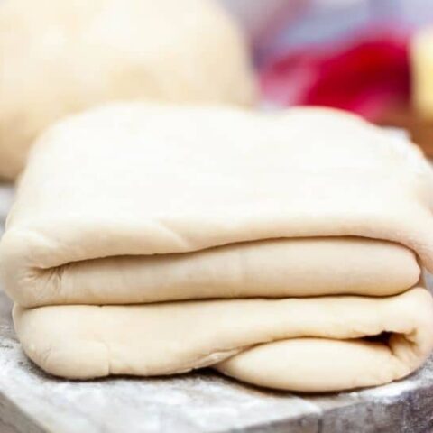 puff pastry on wooden cutting board